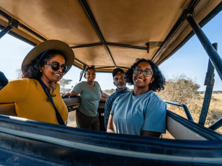 Family enjoying a guided game drive in Tanzania on a Good Earth Tours all inclusive African safari.