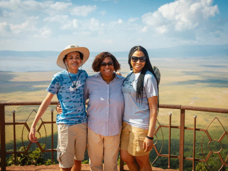 Travelers taking in the view of Ngorongoro Crater during a Tanzania all inclusive safari vacation.