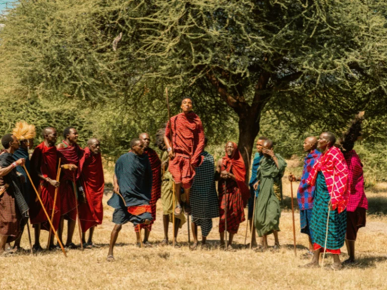 Maasai warriors performing a traditional jumping dance, a cultural highlight included in many all inclusive Tanzania safari packages.