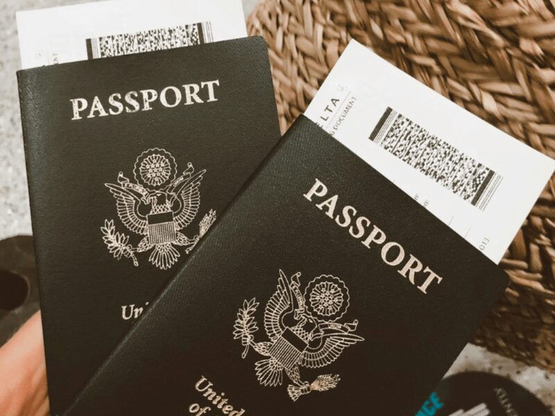 2 US passports with flight tickets