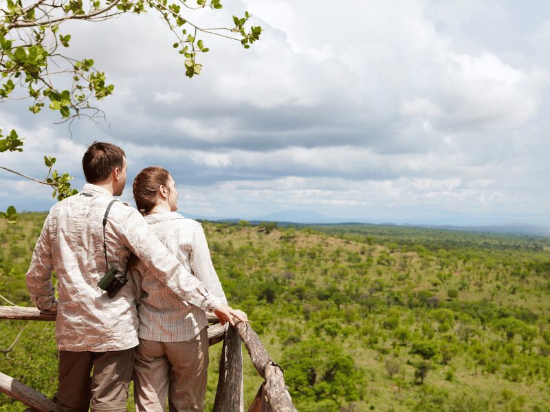 Tanzania safari honeymoon - A couple looking out over the plains
