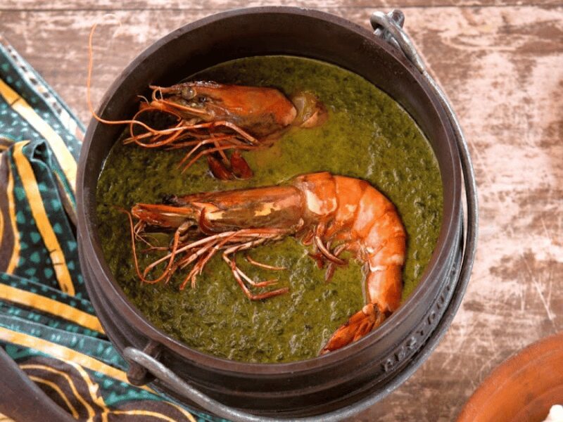 Prawns in a rich stew of cassava leaves and peanuts