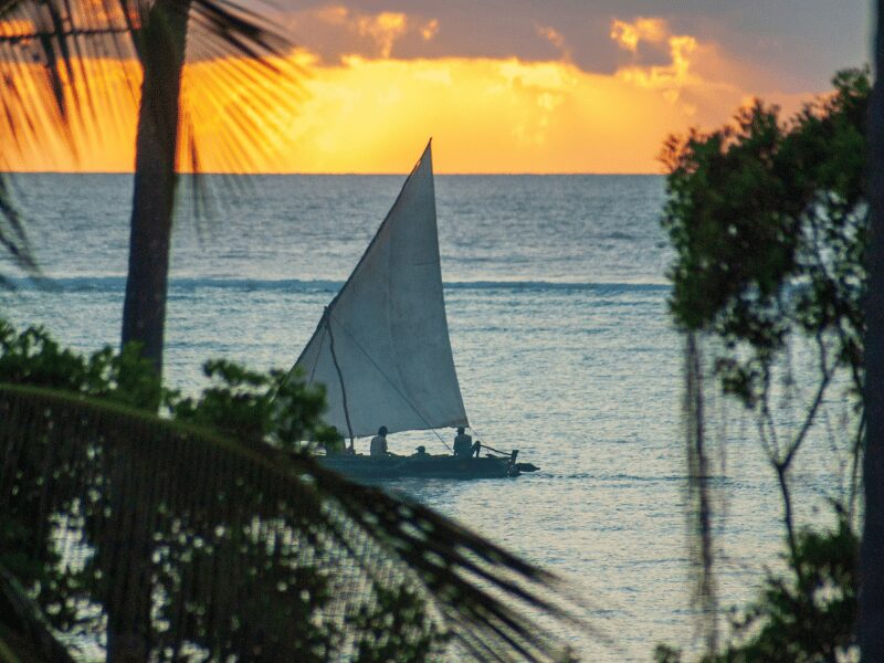 When to Visit Zanzibar: The Best Times for Sunshine, Beaches, and Exploration 3 sunset over the ocean as a boat glides by in the water