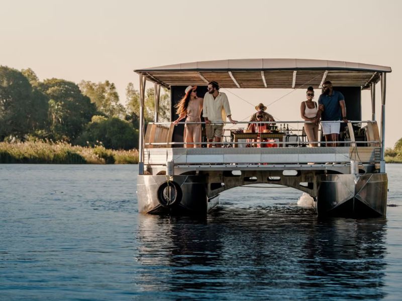 Chobe River cruise with guests looking at the horizon