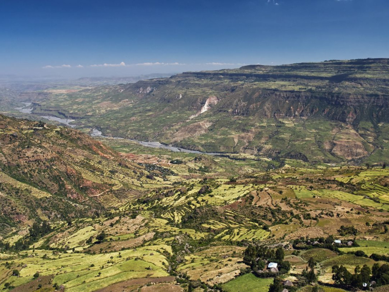 Aerial view of green terraced valleys and river system in Kenya’s Rift Valley.
