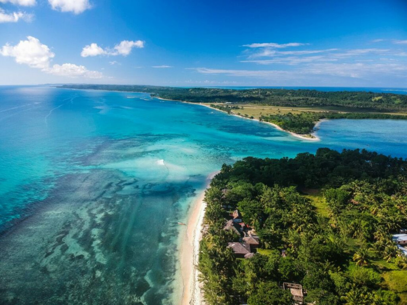Tropical coastline and clear blue water surrounding Île Sainte-Marie, Madagascar.