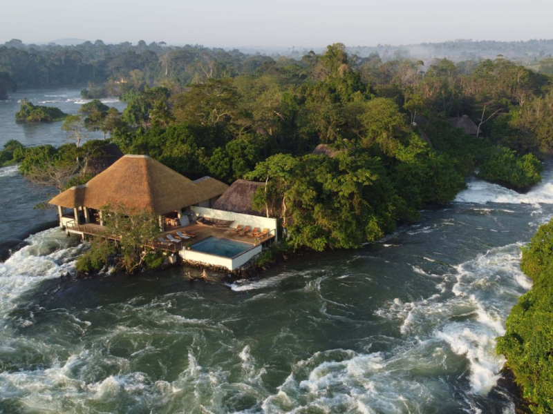 A riverside lodge surrounded by fast-flowing water along the Nile near Jinja.