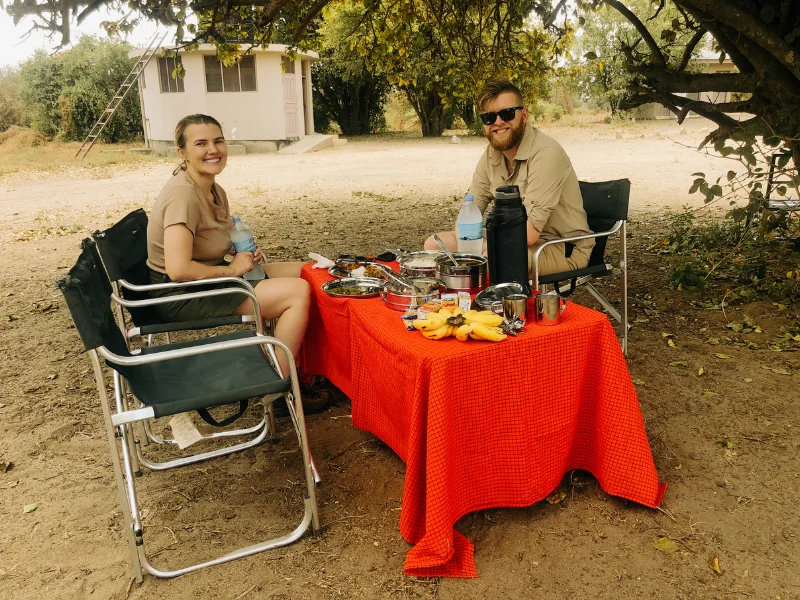Romantic bush picnic setup during an African safari honeymoon experience.