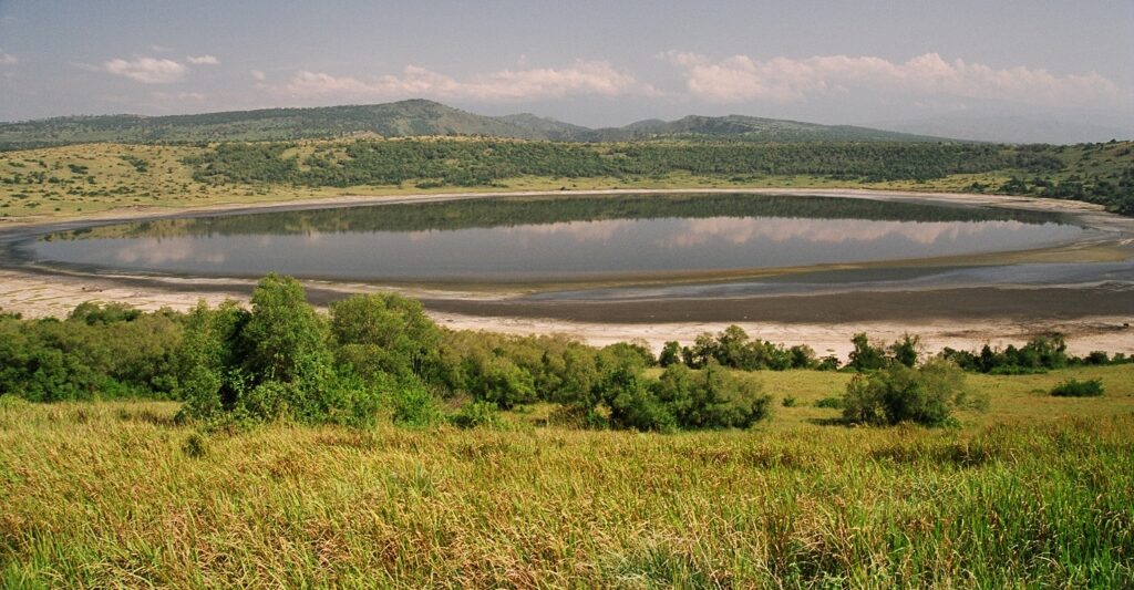 Crater lake landscape inside Queen Elizabeth National Park during a Uganda safari.