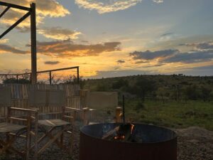 The sunset over the Serengeti from the campfire at Jackals Lair