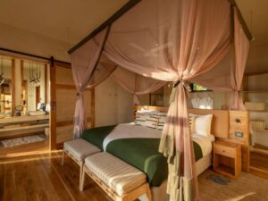 A bedroom at Lemala Osonjoi lodge with the king bed 